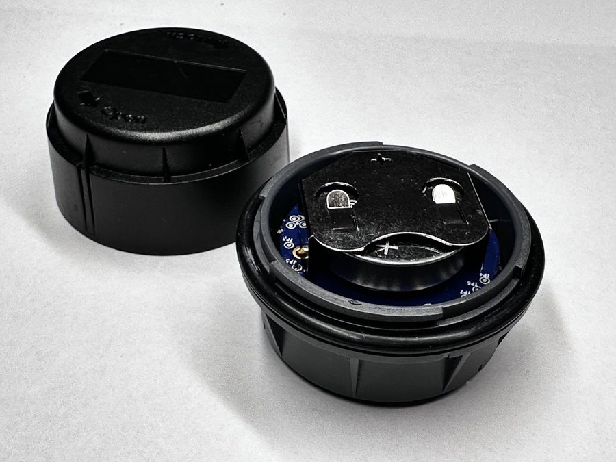 The board stack seated in the casing with the battery holder facing up