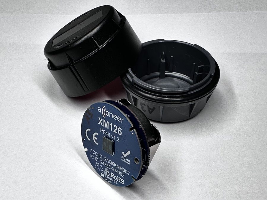 The CA122 casing halves open next to the flashed XM126 module